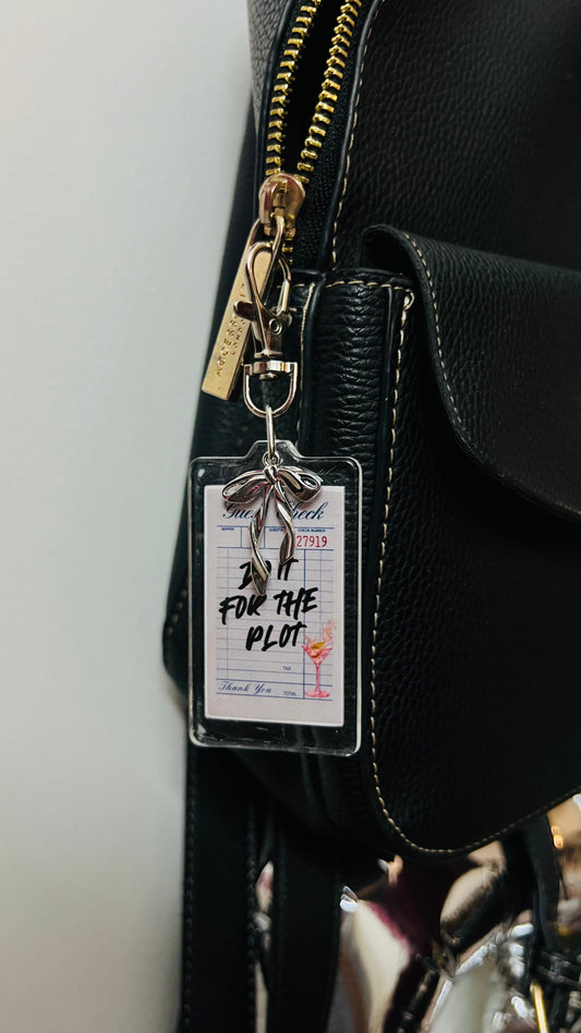 Do It For The Plot acrylic receipt bag charm with a silver bow (view 2)
