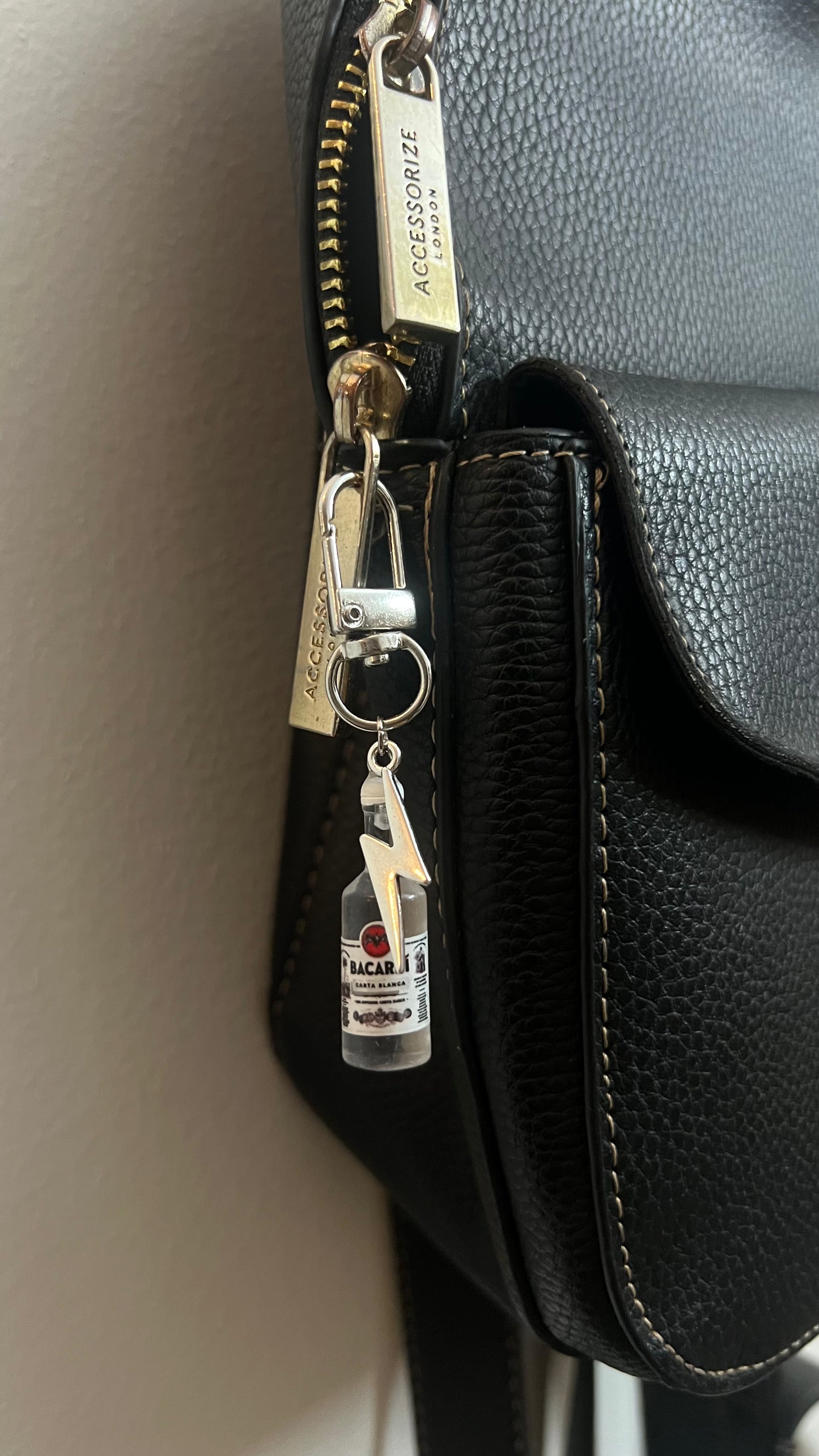 Bacardi Bottle & Lightning Bolt Bag Charm, mini rum bottle charm with a silver lightning bolt