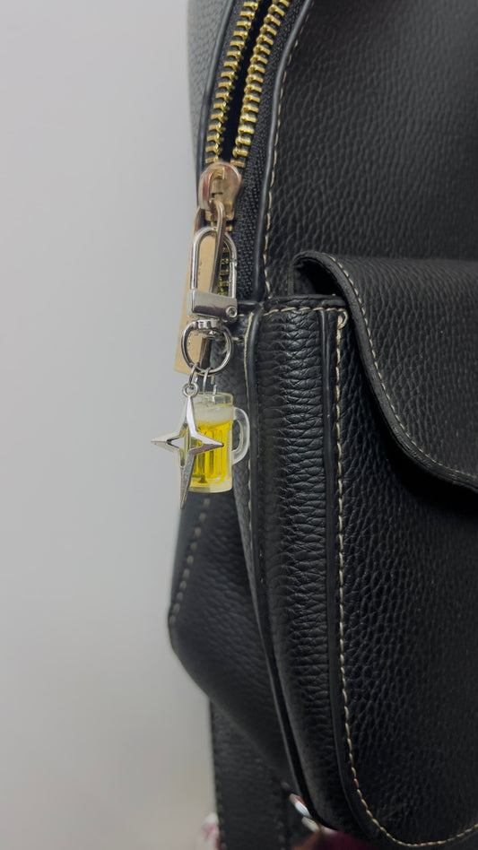 Beer mug bag charm with golden beer and a silver star charm (view 2)