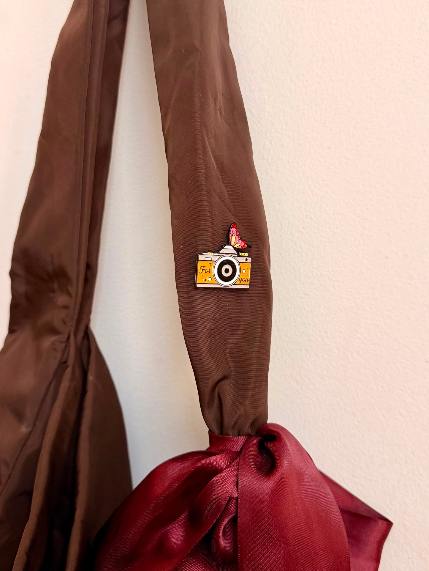 Caught in a Moment Enamel Pin, orange retro film camera reading For you with a butterfly on top