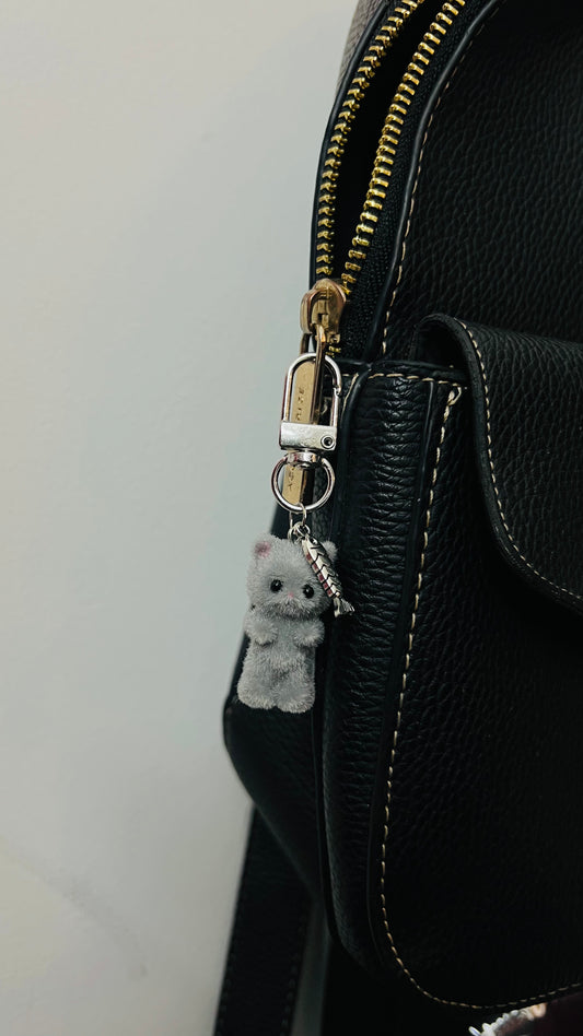 Furry grey cat bag charm with a silver fish charm (view 2)
