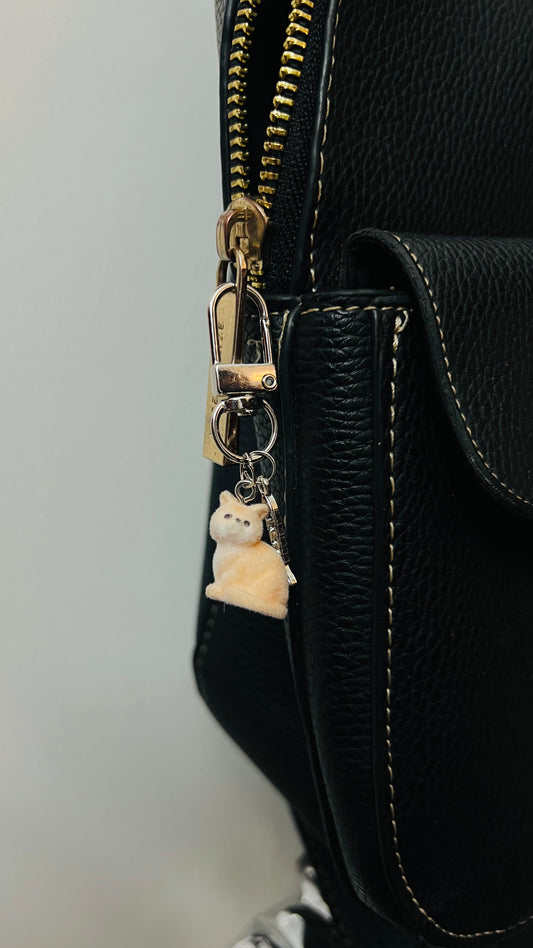 Furry orange cat bag charm with a silver fish charm (view 2)