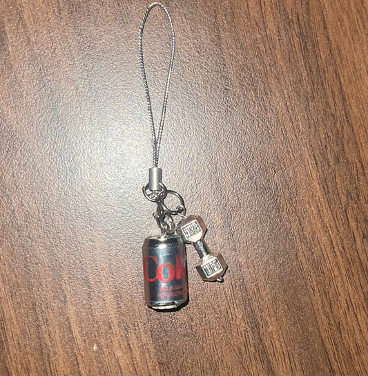 Metallic Diet Coke can phone charm with silver dumbbell pendant on a phone strap lanyard