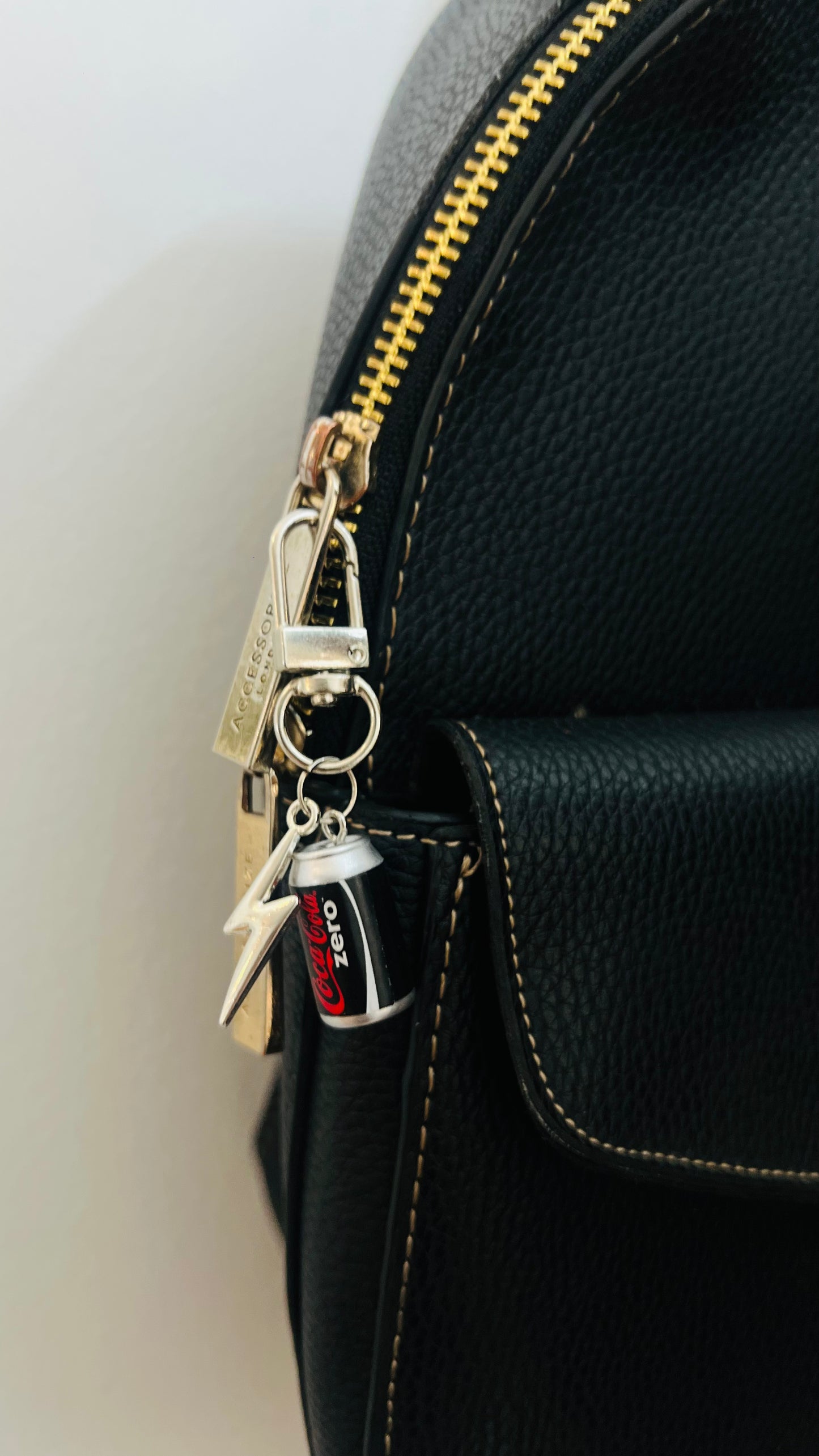 Black Coca-Cola Zero can charm with a silver thunderbolt on a lobster clasp