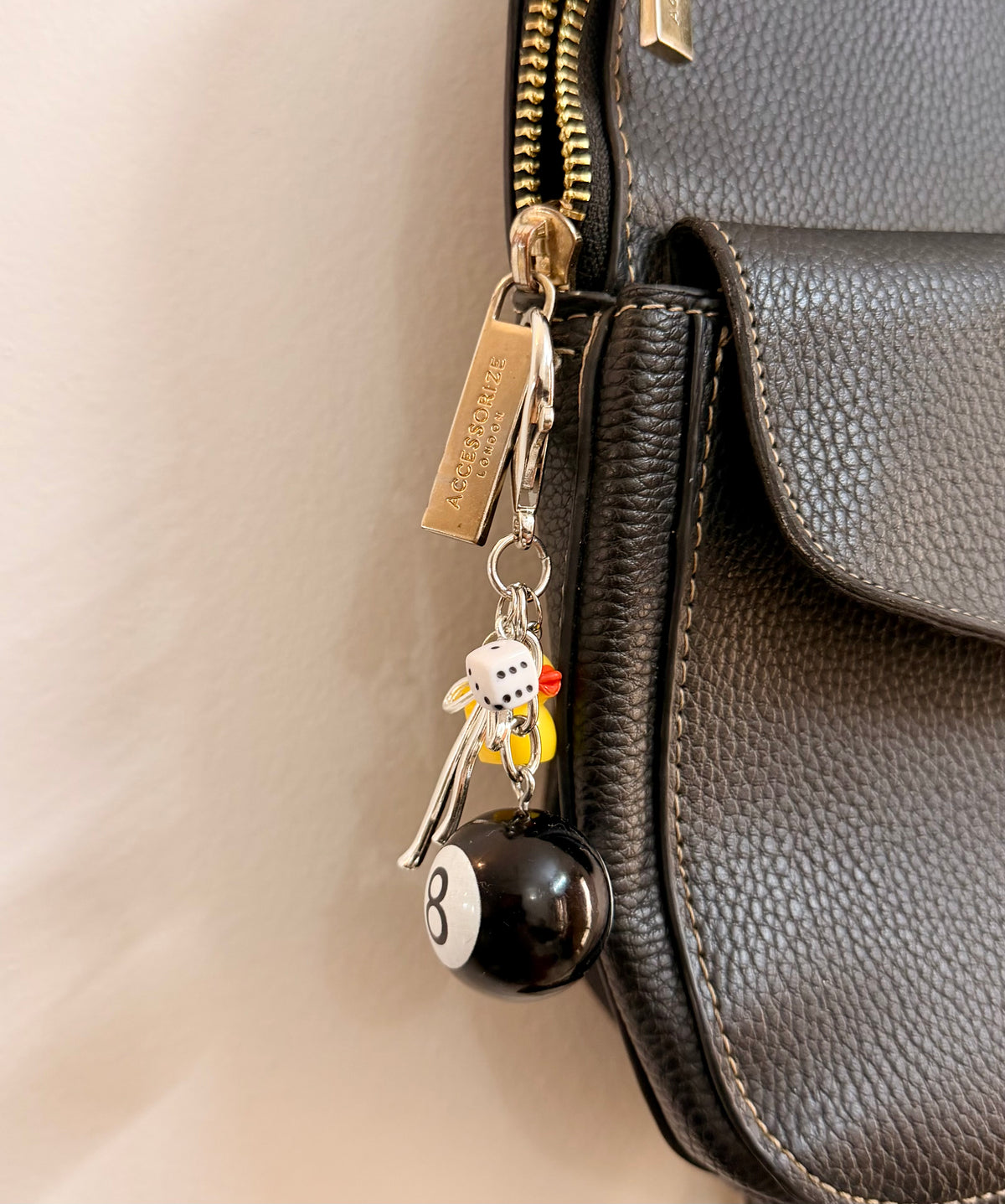 Lucky Break Bag Charm, black 8 ball with a yellow rubber duck and silver bow on a keyring
