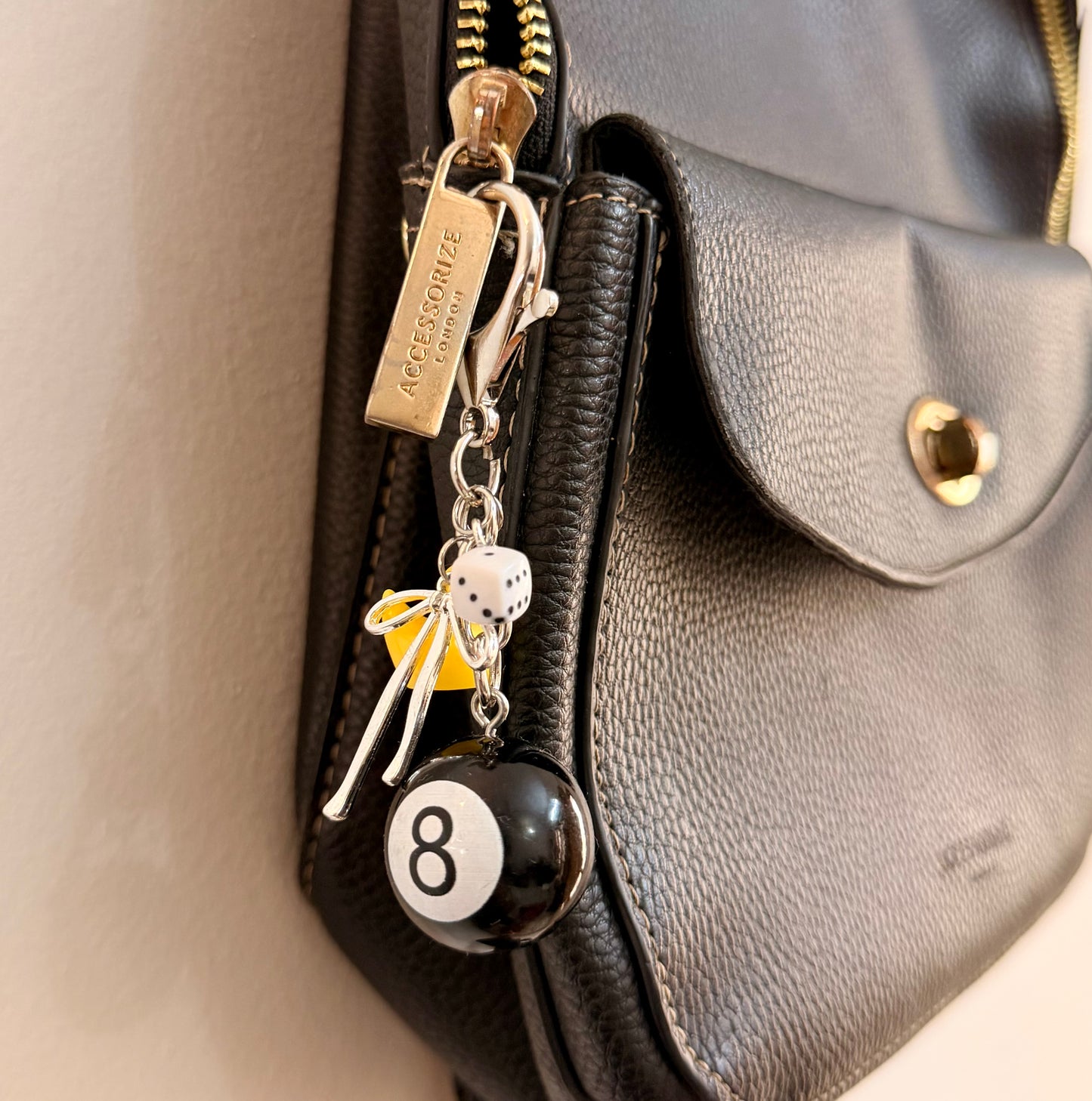 Lucky Break Bag Charm, black 8 ball with a yellow rubber duck and silver bow on a keyring