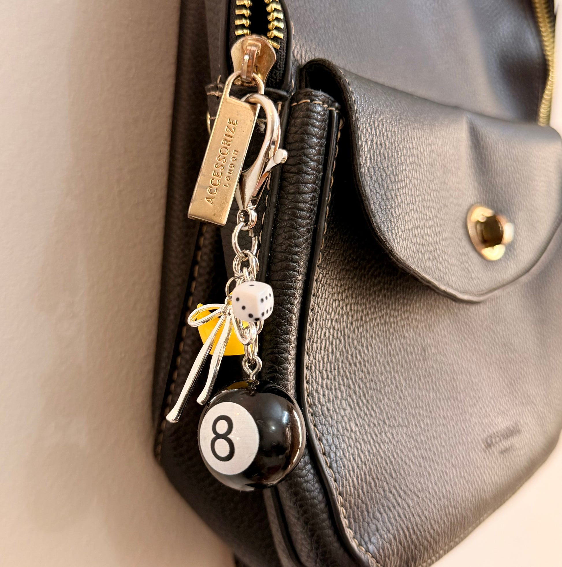 Lucky Break Bag Charm, black 8 ball with a yellow rubber duck and silver bow on a keyring