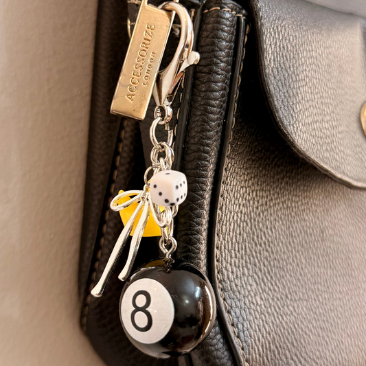 Lucky Break Bag Charm, black 8 ball with a yellow rubber duck and silver bow on a keyring