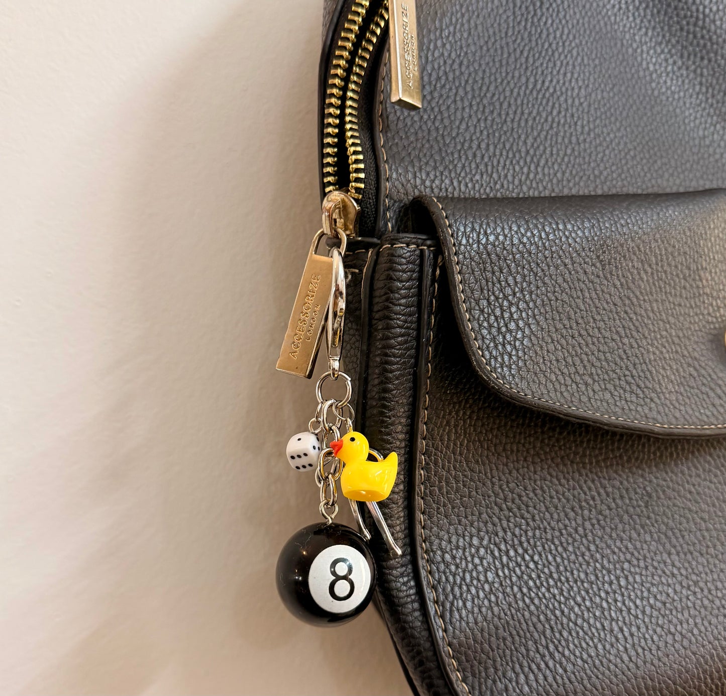 Lucky Break Bag Charm, black 8 ball with a yellow rubber duck and silver bow on a keyring