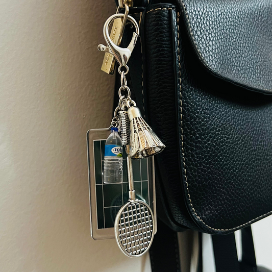 Badminton Racket & Shuttlecock Bag Charm, silver badminton racket and shuttlecock charm with an acrylic court panel