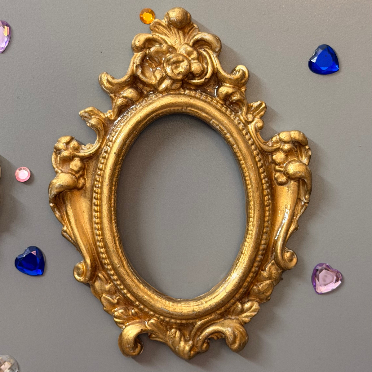 Antique Royal Magnetic Frame, empty gold concrete baroque frame showing the scrollwork and rose crest