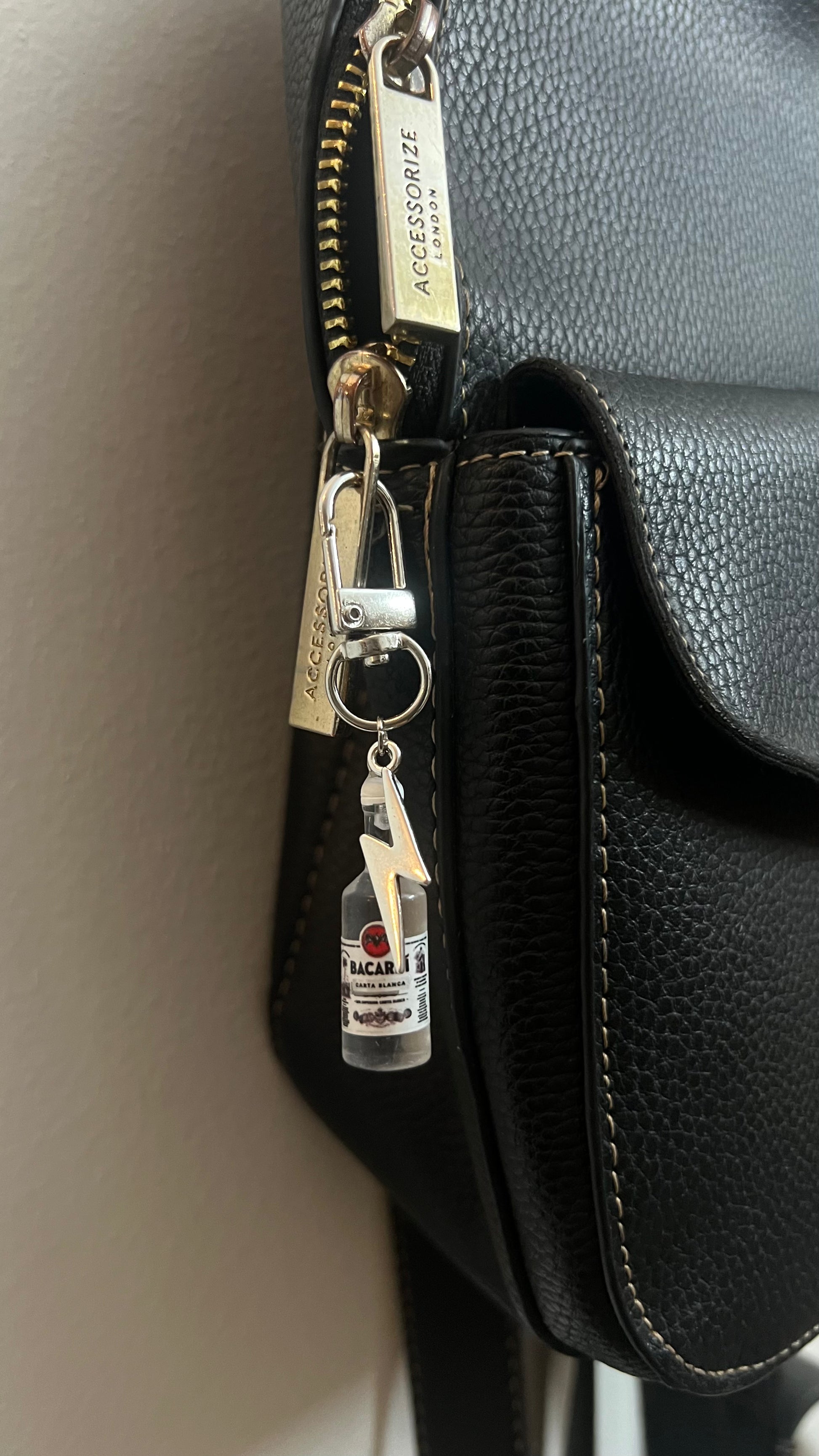 Bacardi Bottle & Lightning Bolt Bag Charm, mini rum bottle charm with a silver lightning bolt
