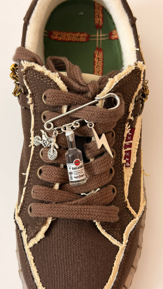 Bad Influence, silver brooch pin with dirt bike, Bacardi bottle and lightning bolt charms