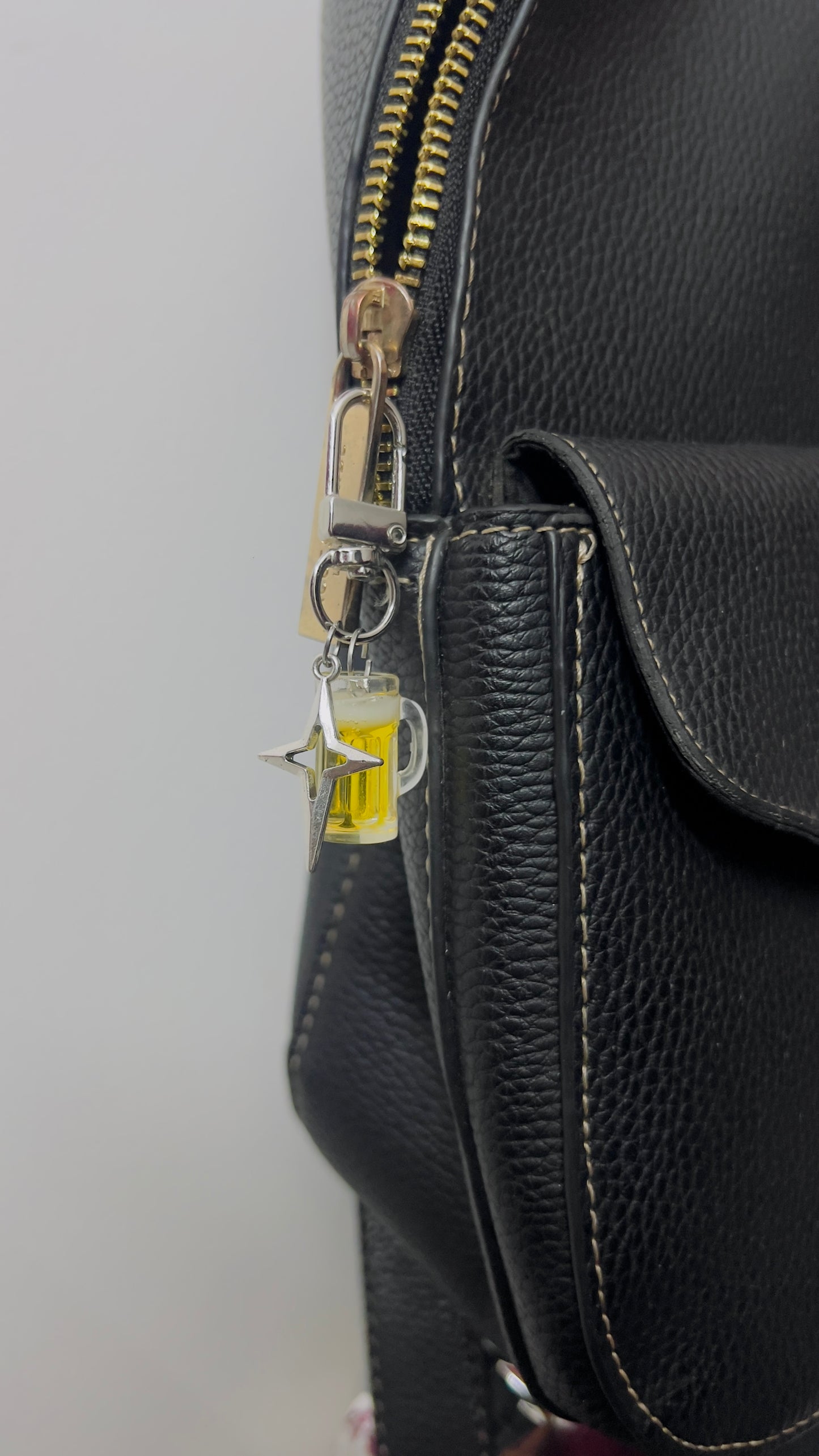 Beer mug bag charm with golden beer and a silver star charm (view 2)