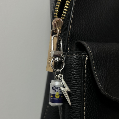 Corona Extra beer can bag charm with a silver thunderbolt charm