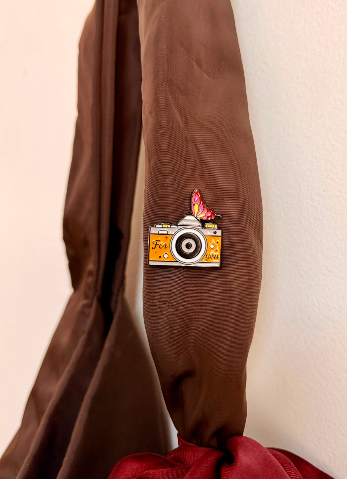 Caught in a Moment Enamel Pin, orange retro film camera reading For you with a butterfly on top