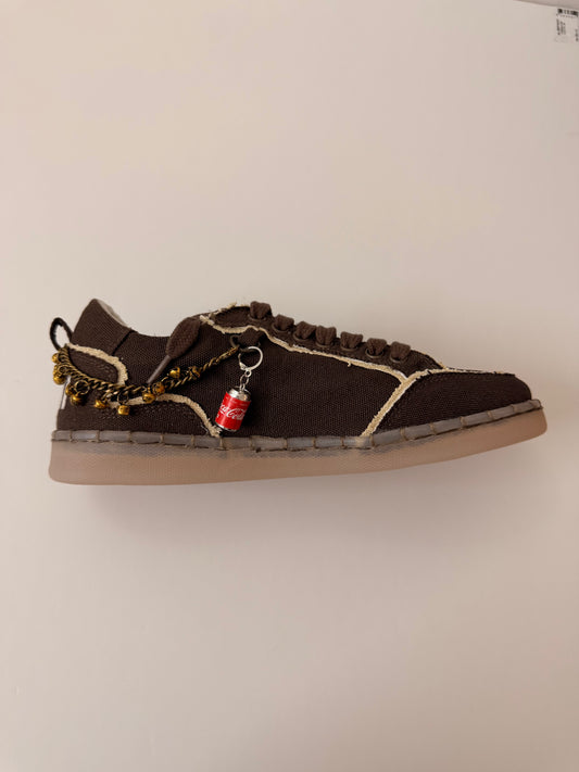 Coca-Cola Shoe Charm, mini red Coca-Cola can charm on the laces of a brown canvas sneaker
