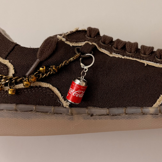 Coca-Cola Shoe Charm, mini red Coca-Cola can charm on the laces of a brown canvas sneaker