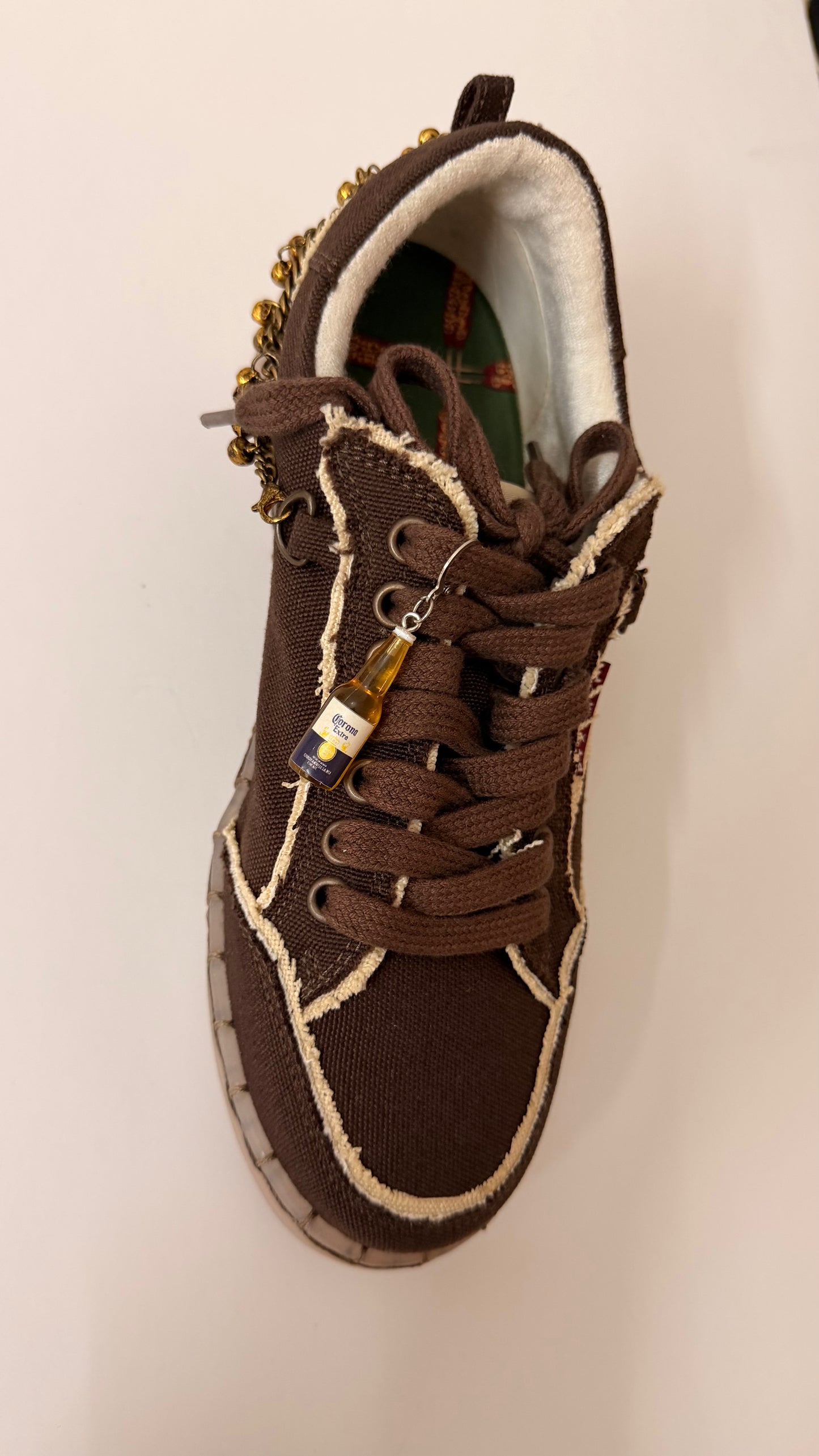Corona Shoe Charm, mini Corona Extra beer bottle charm on the laces of a brown canvas sneaker
