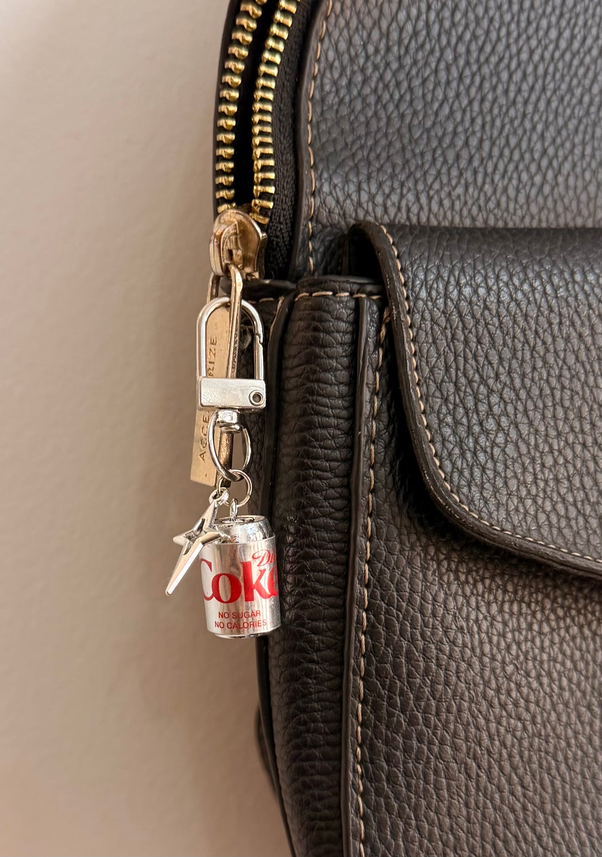 Metallic Diet Coke Star Bling D-Hook Bag Charm, silver Diet Coke can with a silver star charm on a D-hook clasp