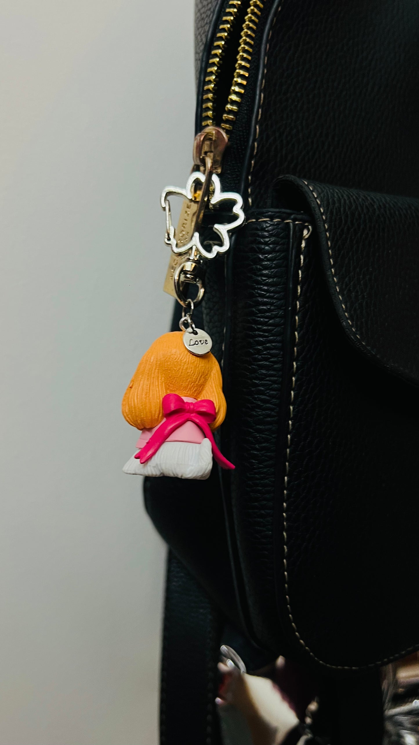 Golden puppy bag charm dressed in a pink outfit (view 3)