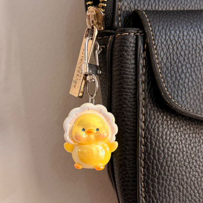 Duckie boo, a yellow duck in a white ruffle collar.