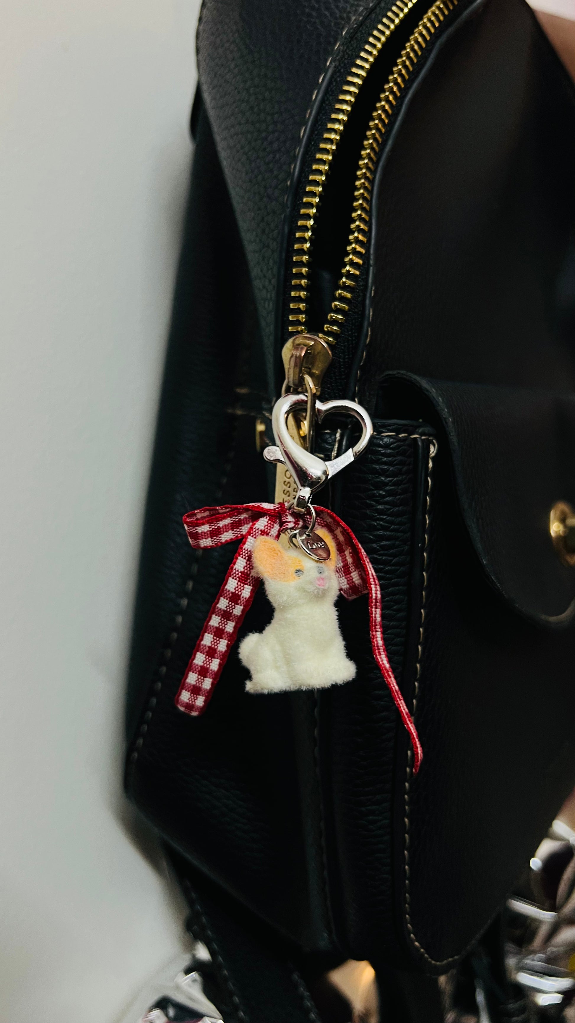 Furry puppy bag charm with a red gingham bow (view 2)