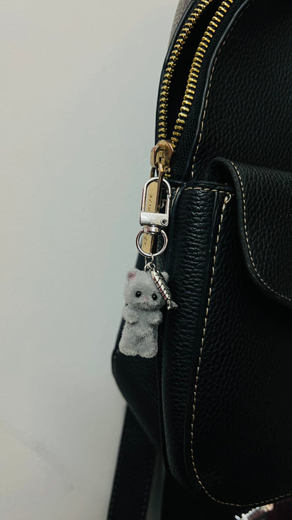 Furry grey cat bag charm with a silver fish charm (view 2)