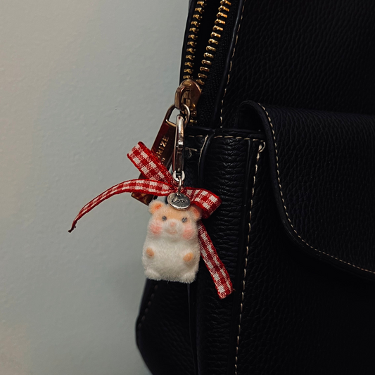 Furry hamster bag charm with a red gingham bow