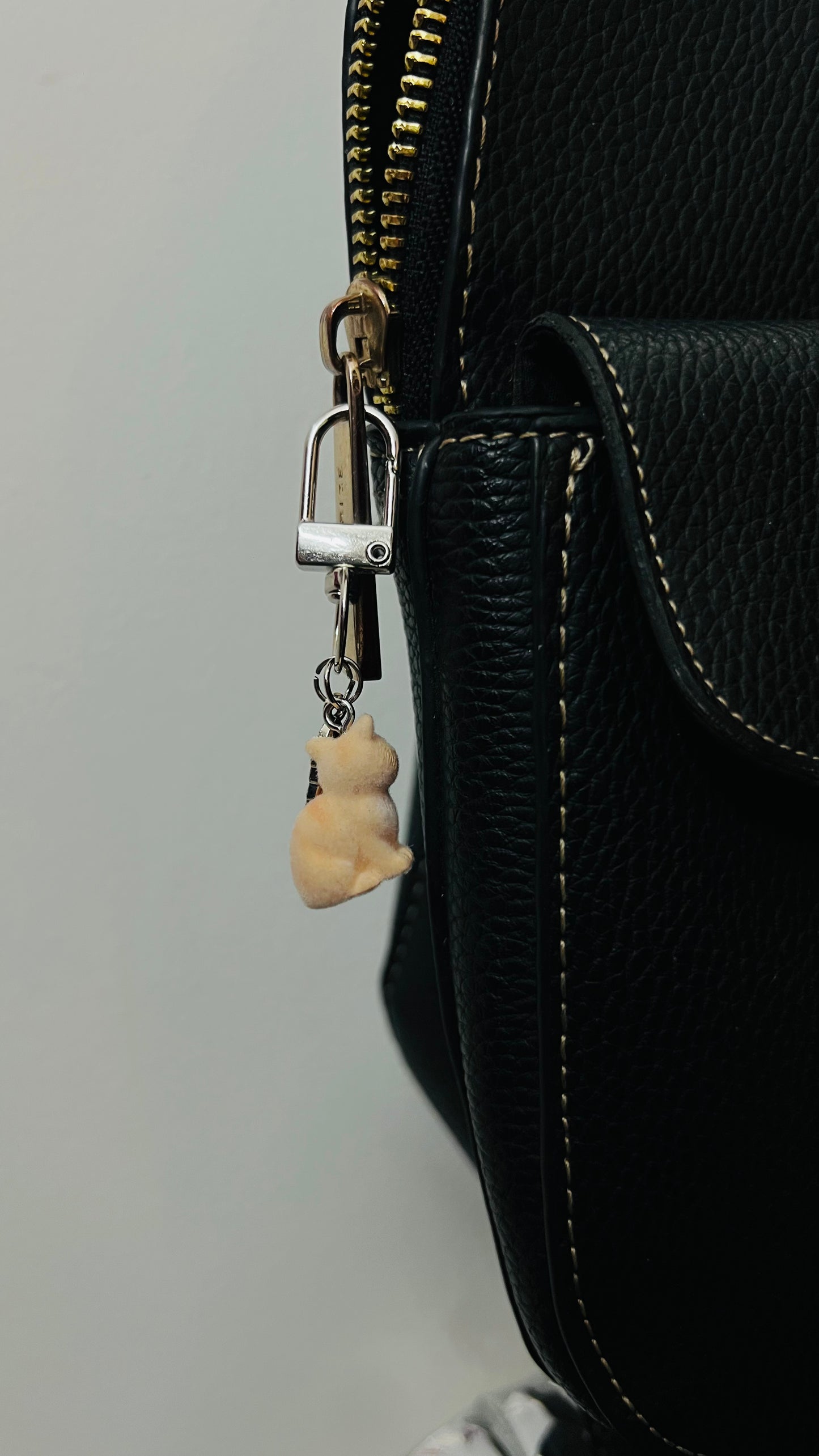 Furry orange cat bag charm with a silver fish charm (view 4)