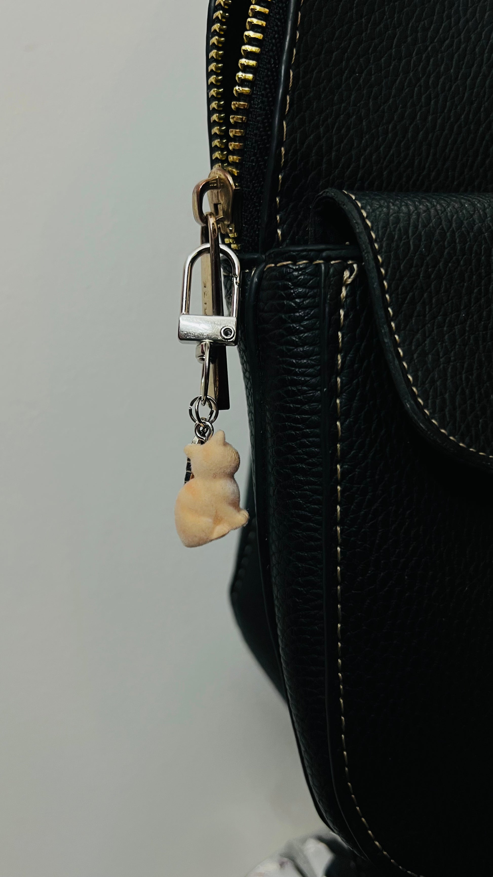 Furry orange cat bag charm with a silver fish charm (view 4)