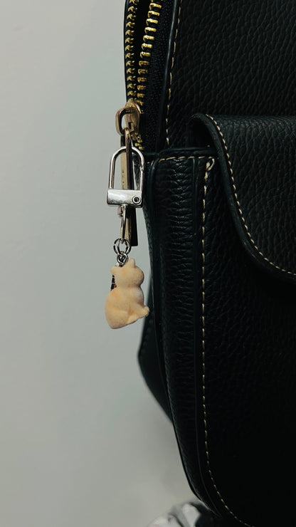 Furry orange cat bag charm with a silver fish charm (view 4)