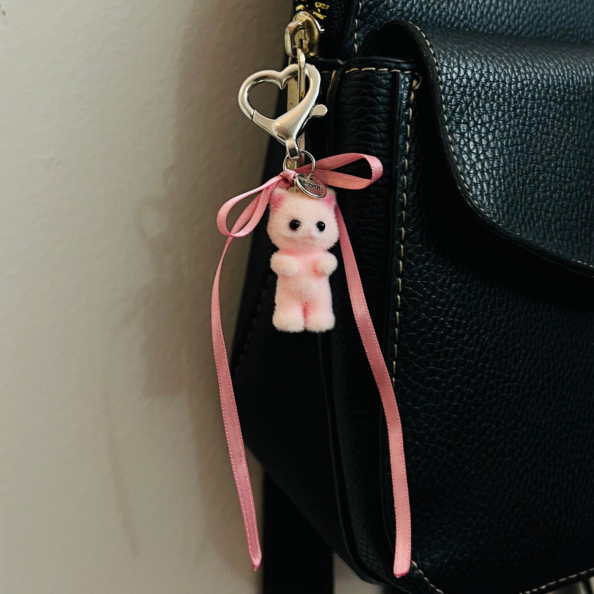 Furry pink cat bag charm with pink ribbon bows
