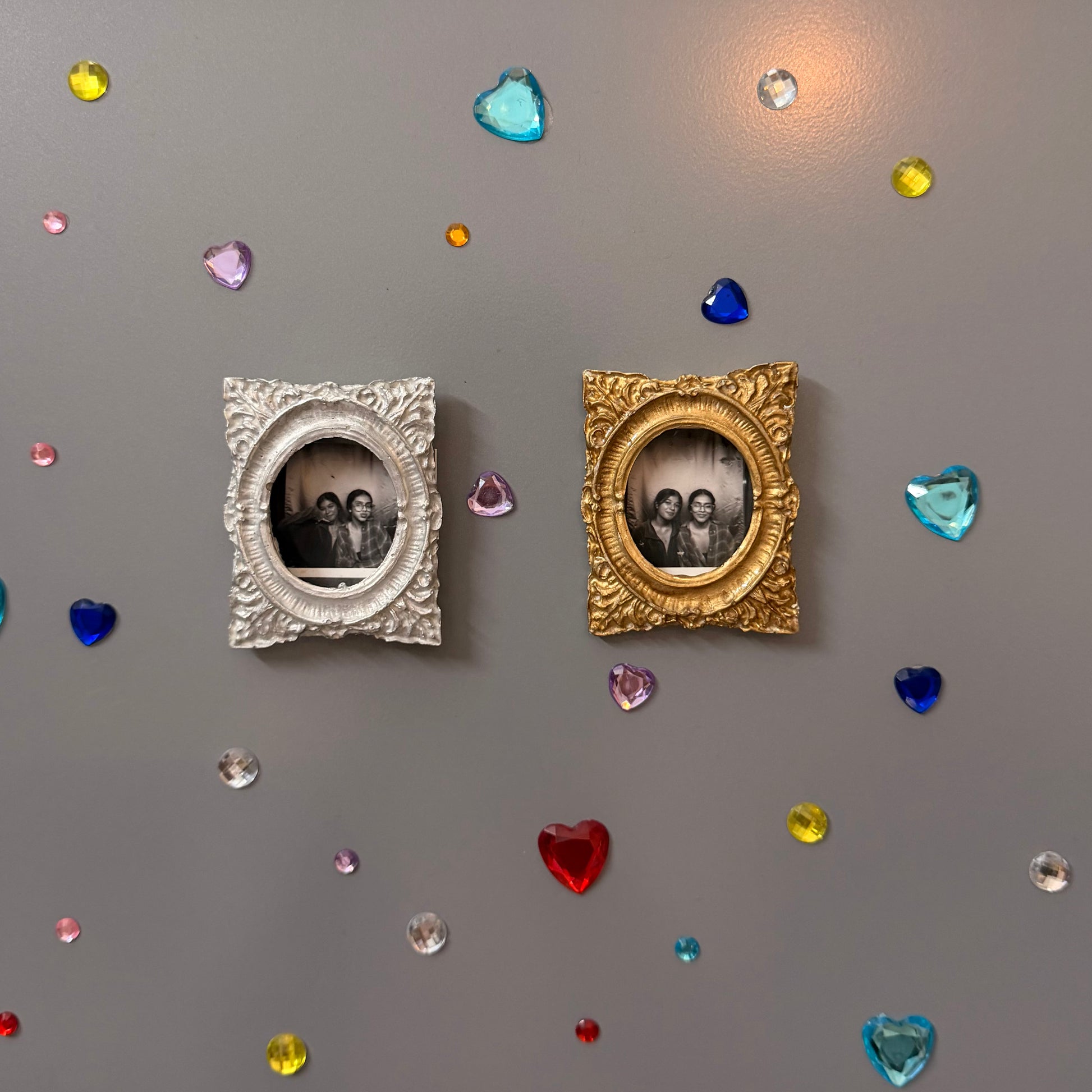 Hold This Moment Magnetic Frame, silver and gold concrete frames side by side on a fridge door