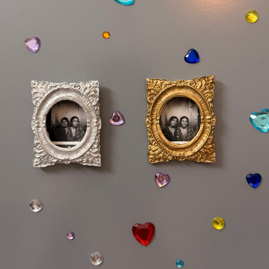 Hold This Moment Magnetic Frame, silver and gold concrete frames with oval openings, each holding a photo