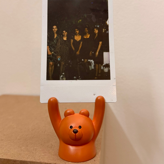 Brown Bear Photo Holder, brown bear holding a polaroid up in its raised paws