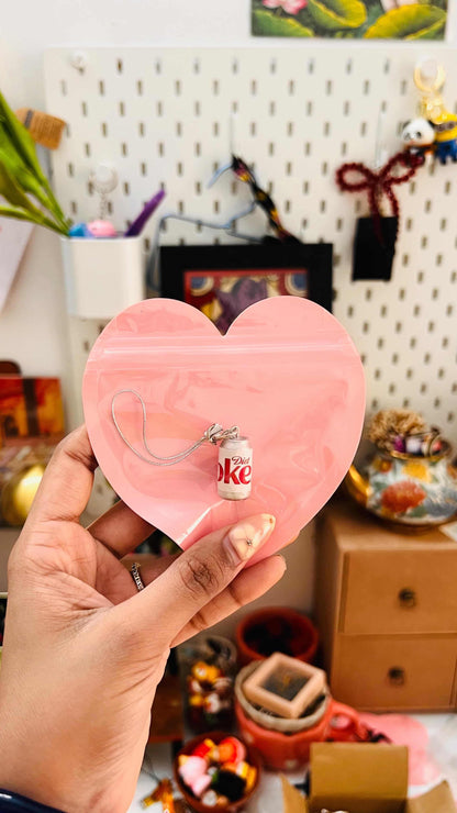 White Diet Coke can phone charm with silver strap in a pink heart gift pouch