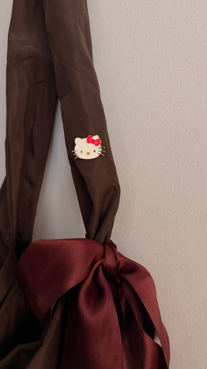 Kitty Core Enamel Pin, cute cat face lapel pin with a red bow, view 2