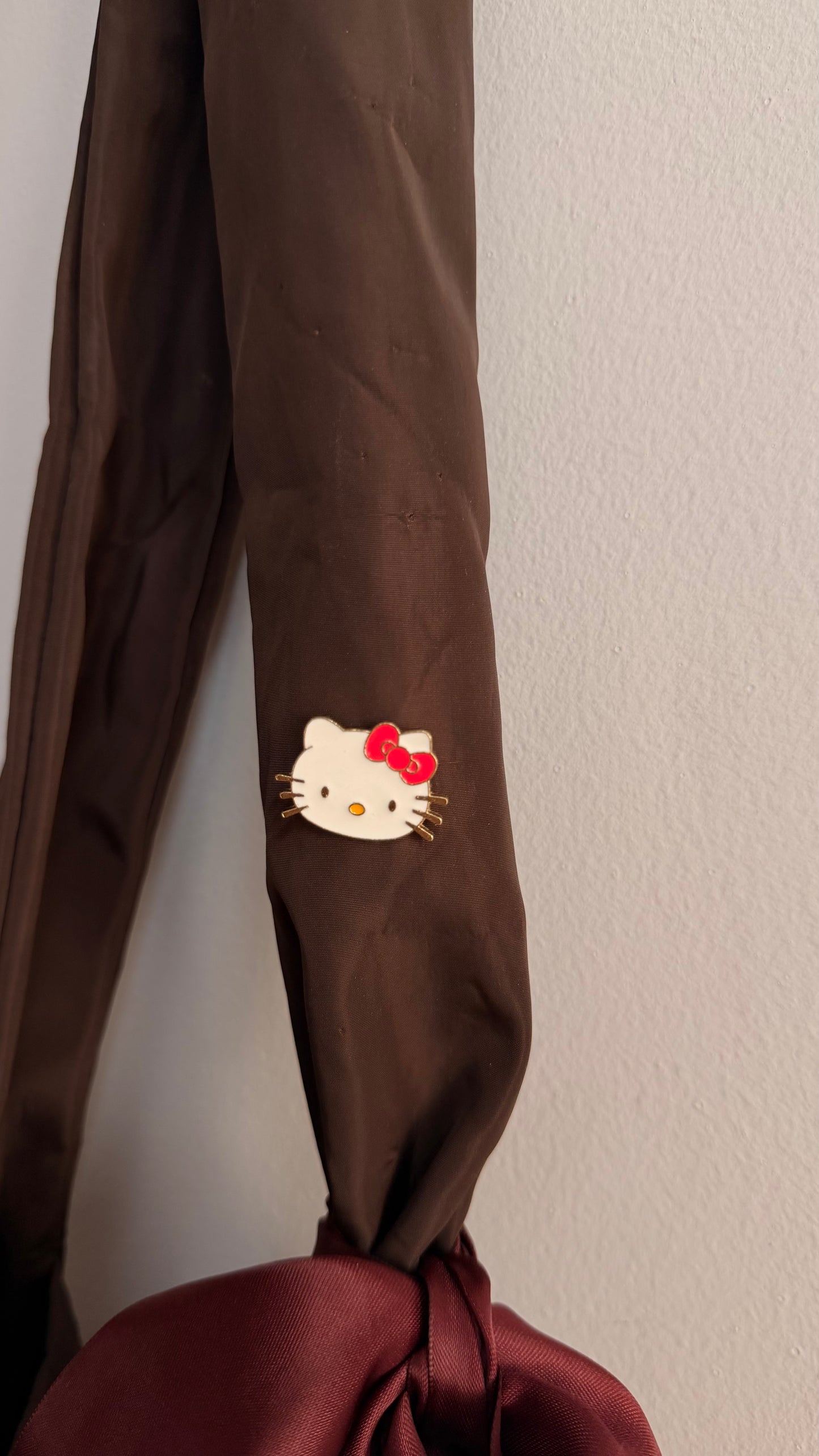 Kitty Core Enamel Pin, cute cat face lapel pin with a red bow, view 3