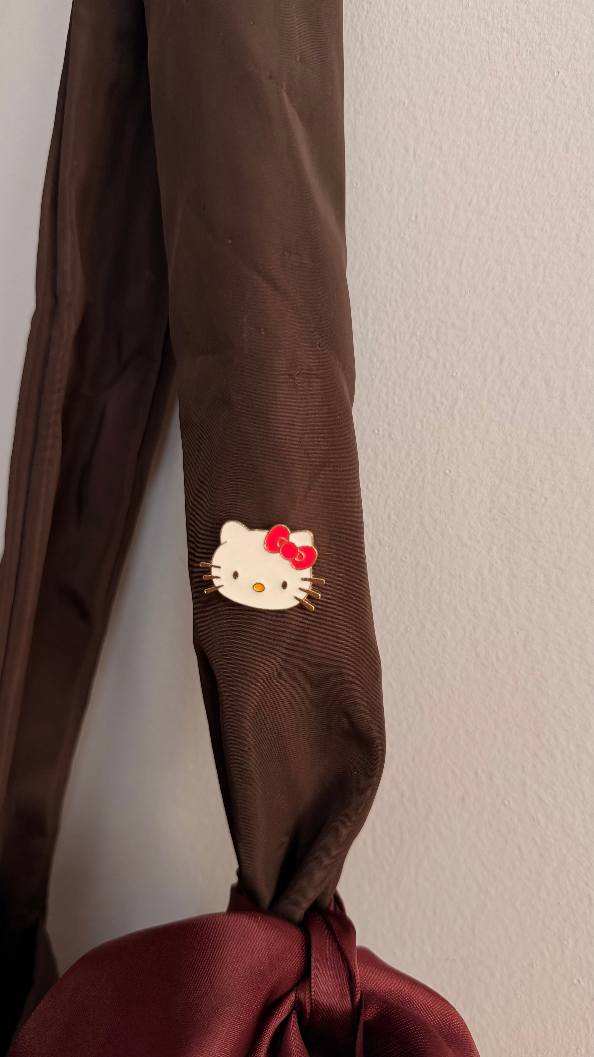 Kitty Core Enamel Pin, cute cat face lapel pin with a red bow, view 3