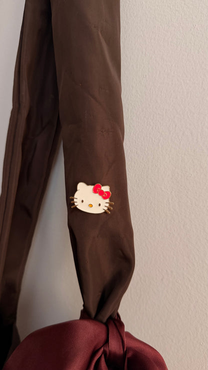 Kitty Core Enamel Pin, cute cat face lapel pin with a red bow, view 3