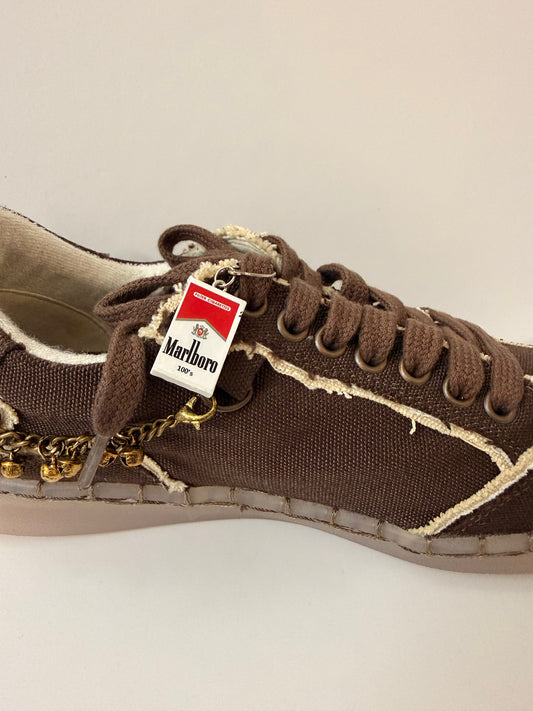 Marlboro Shoe Charm, mini Marlboro 100's pack charm on the laces of a brown canvas sneaker