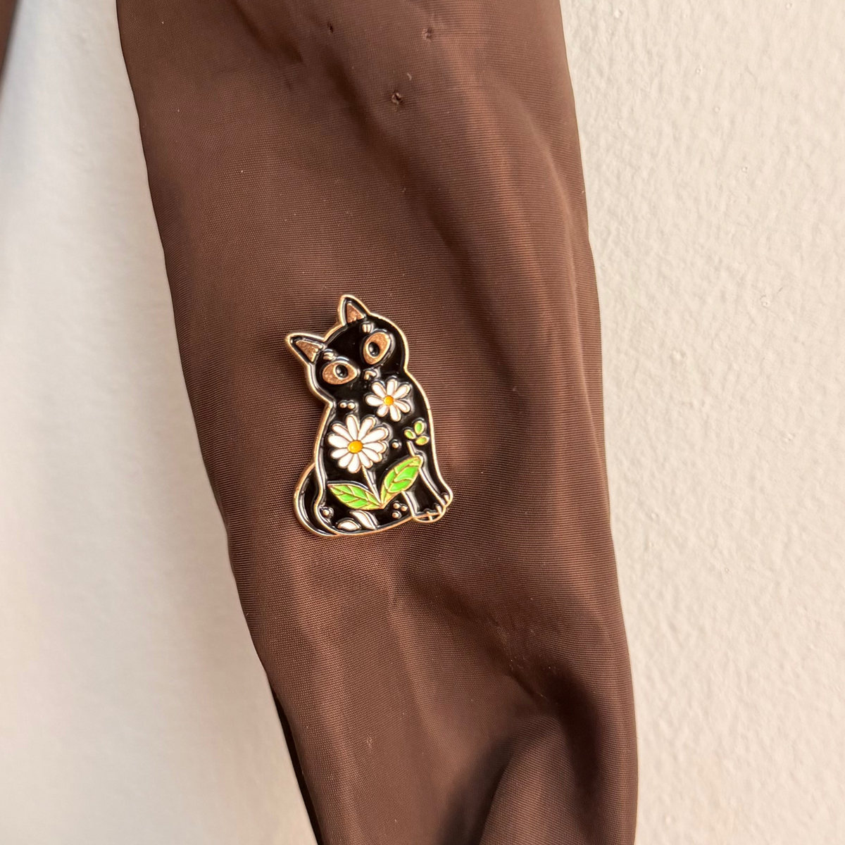 Meow in Bloom Enamel Pin, cat surrounded by blooming flowers lapel pin