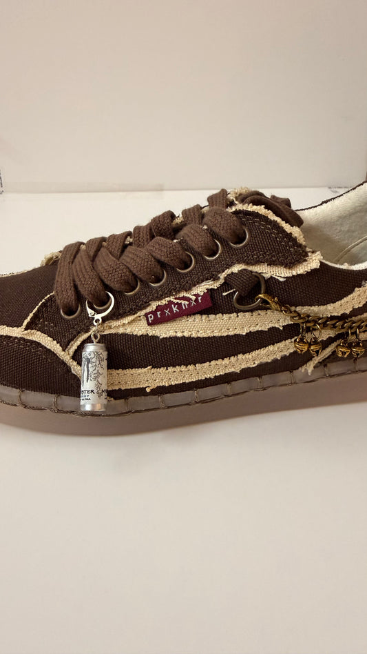 White Monster Energy Shoe Charm, mini white Monster Energy Ultra can charm on the laces of a brown canvas sneaker