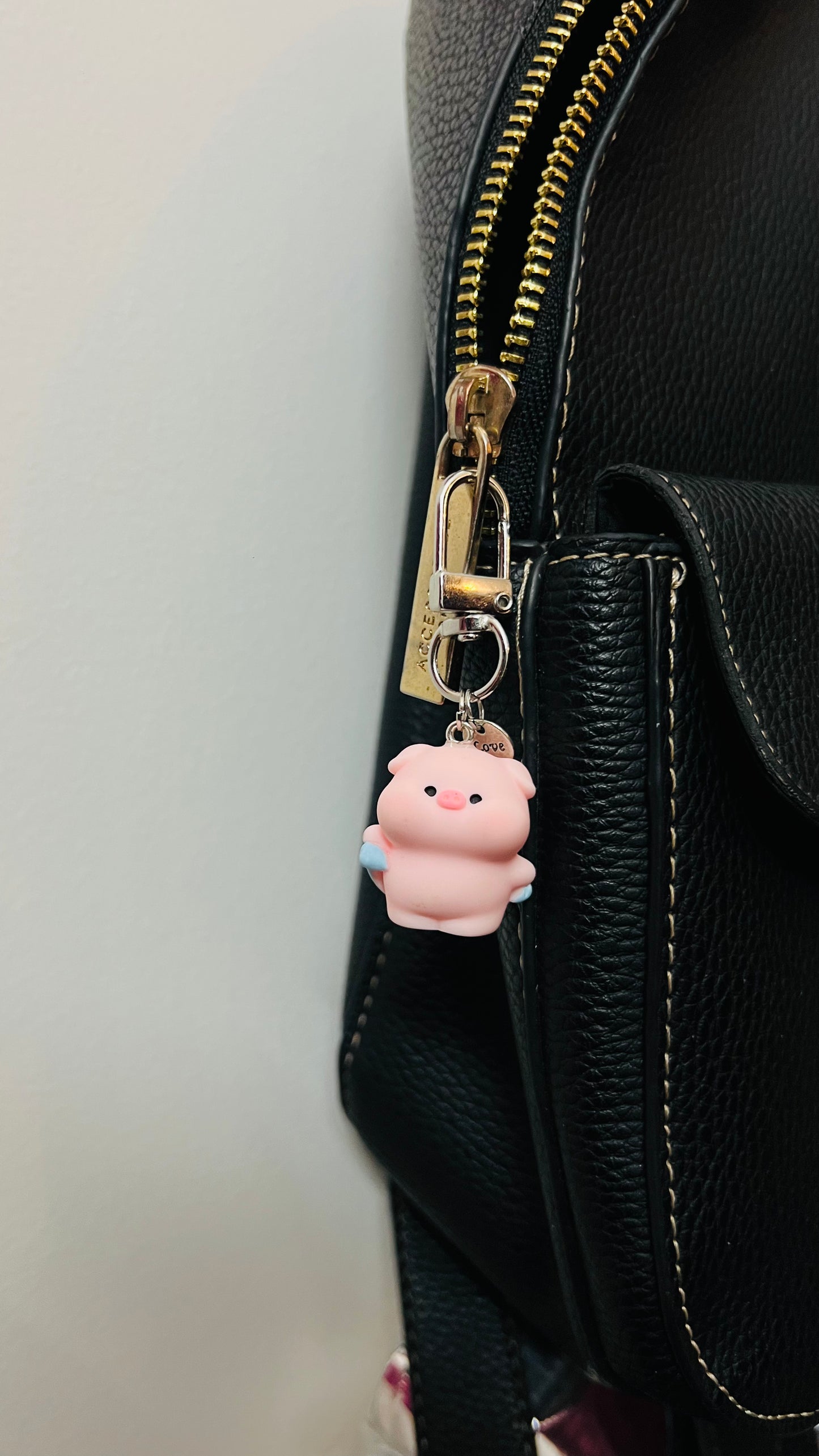 Pink Piggu piglet bag charm wrapped in a blue towel (view 2)