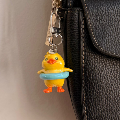 Pool Party Duck, a yellow duck in a pale blue swim ring.
