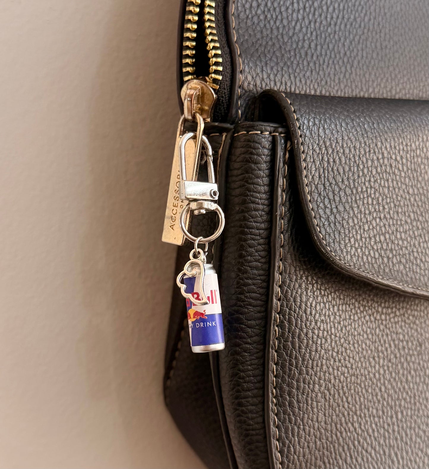 Red Bull Wings D-Hook Bag Charm, blue and silver Red Bull can with silver wings charm on a D-hook clasp