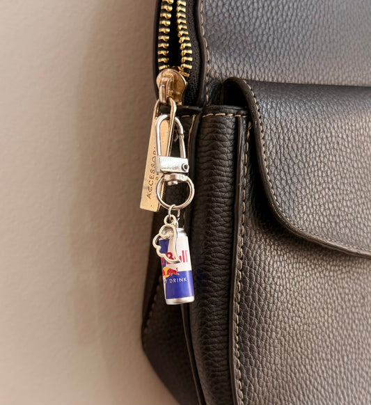 Red Bull Wings D-Hook Bag Charm, blue and silver Red Bull can with silver wings charm on a D-hook clasp