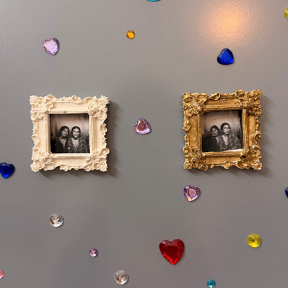 The Nostalgic Magnetic Frame, white and gold concrete square frames side by side, each holding a photo