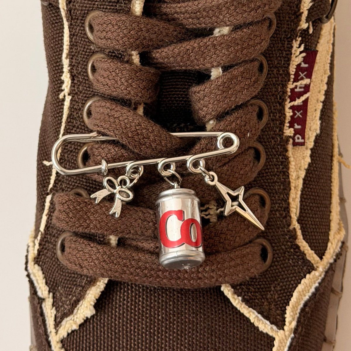 The Pop Charm, silver brooch pin with bow, Diet Coke can and star charms